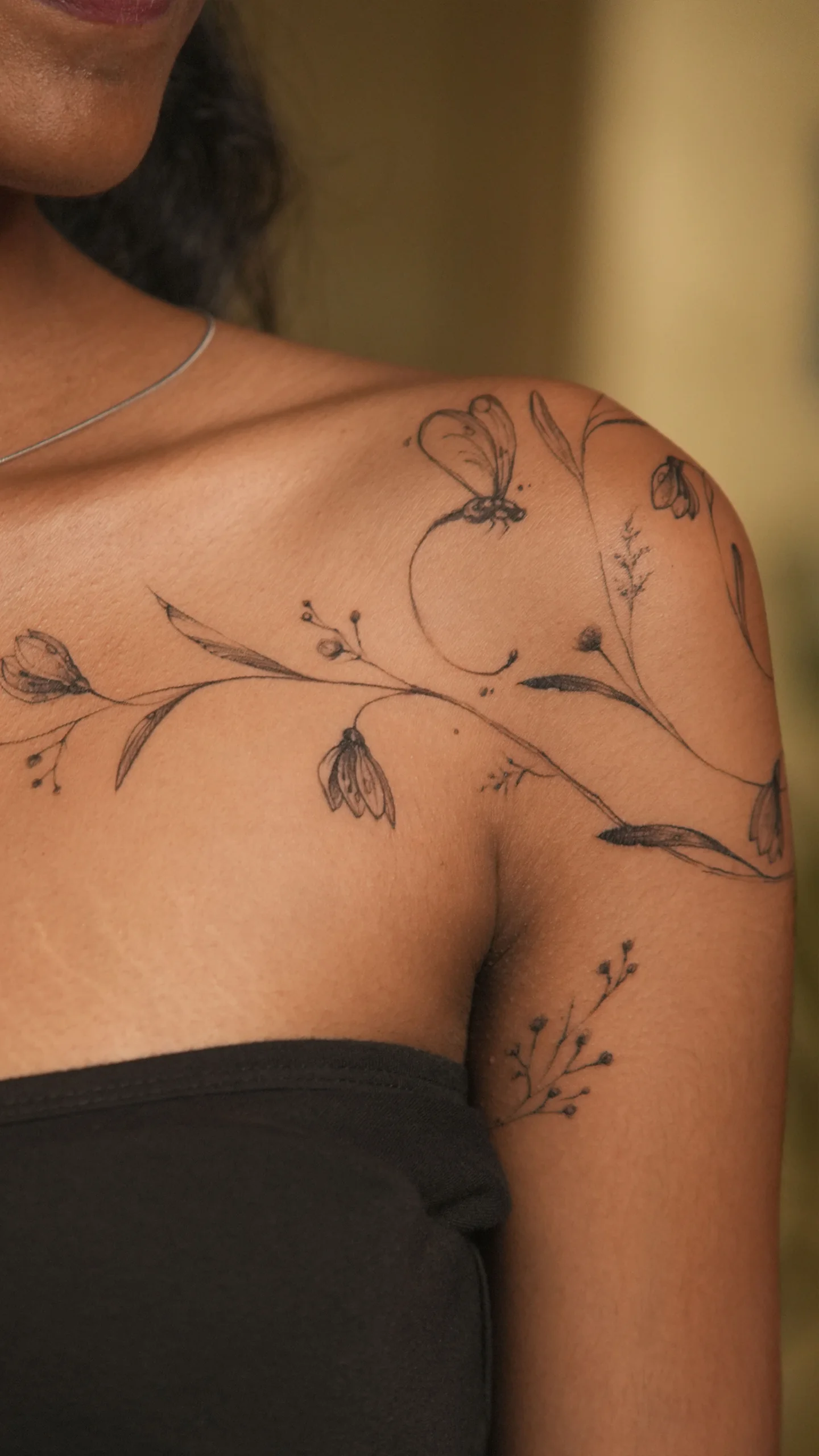 Minimal black and grey tattoo inspired by natural forms and soft symbolism by Anu