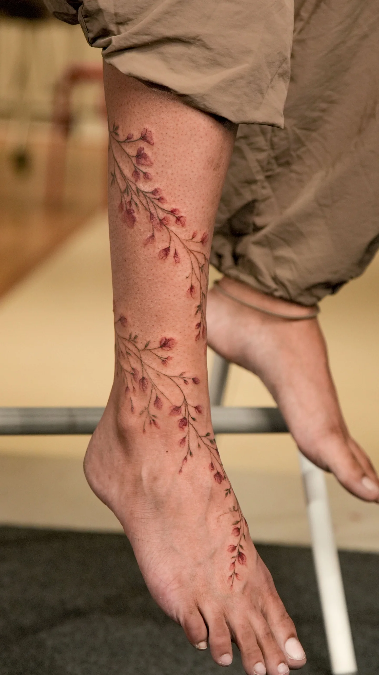 Illustrative fine line tattoo with elegant flow and balanced negative space by Anu