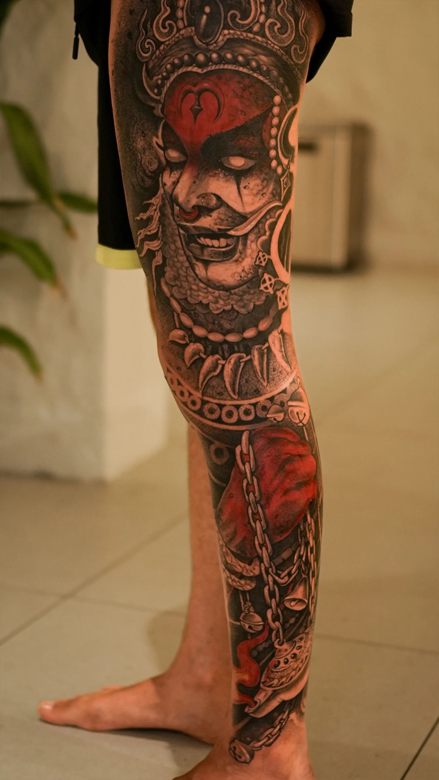 Black and grey illustrative tattoo with subtle tonal transitions by Eric Edward