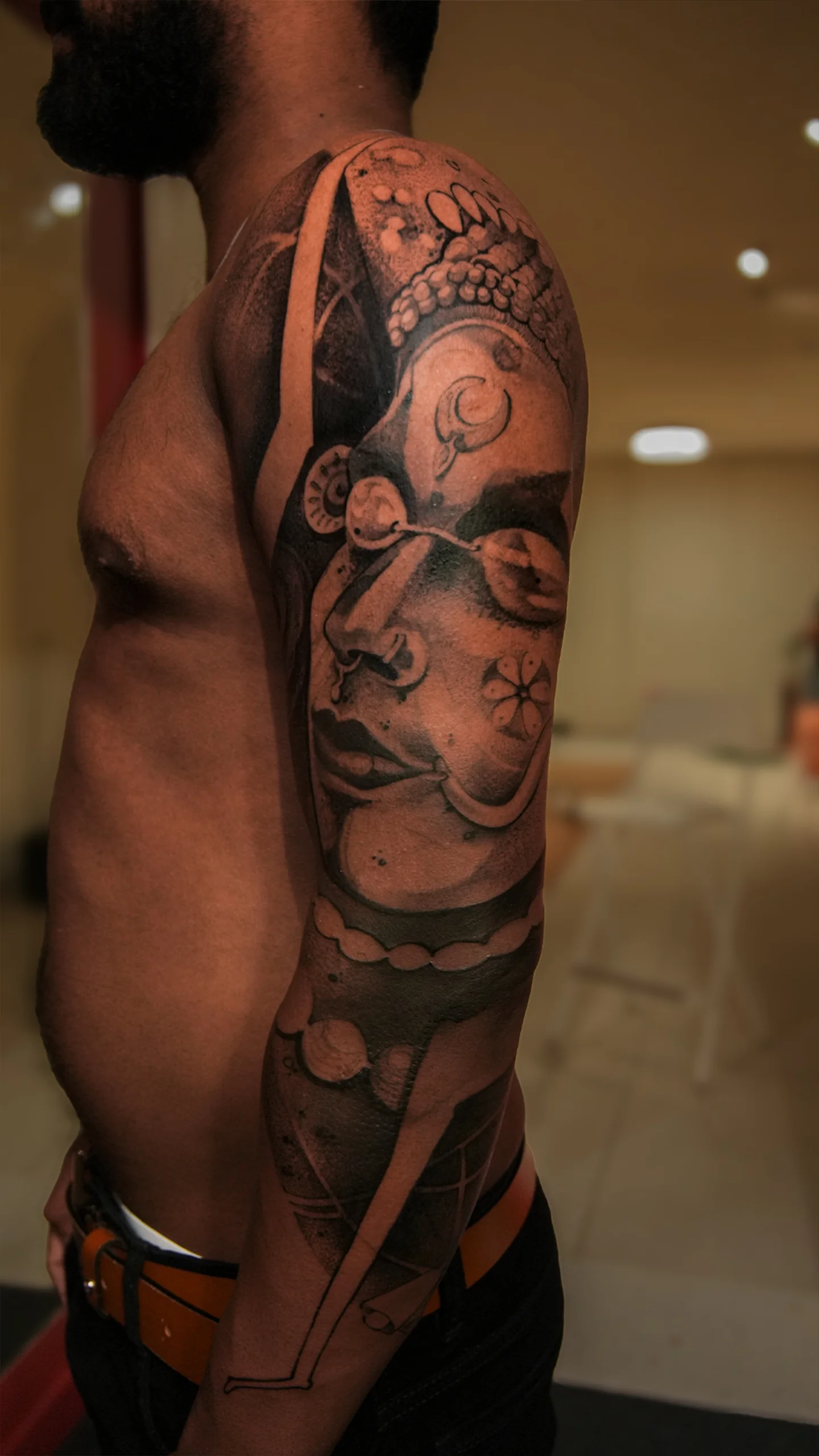 Semi-realistic illustrative tattoo with detailed contrast by Eric Edward