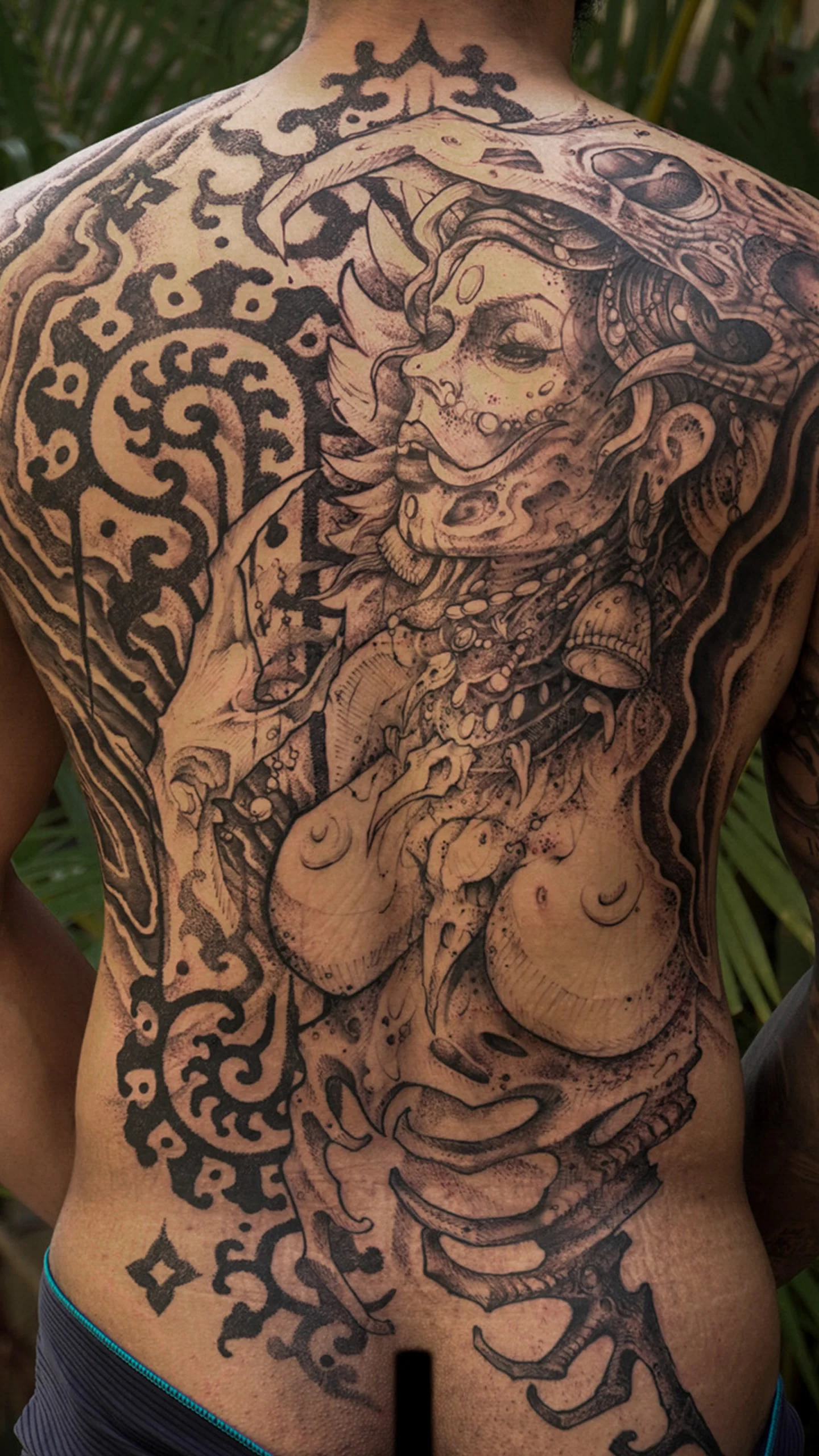 Black and grey conceptual tattoo with expressive linework and dramatic shading by Otzi Marc