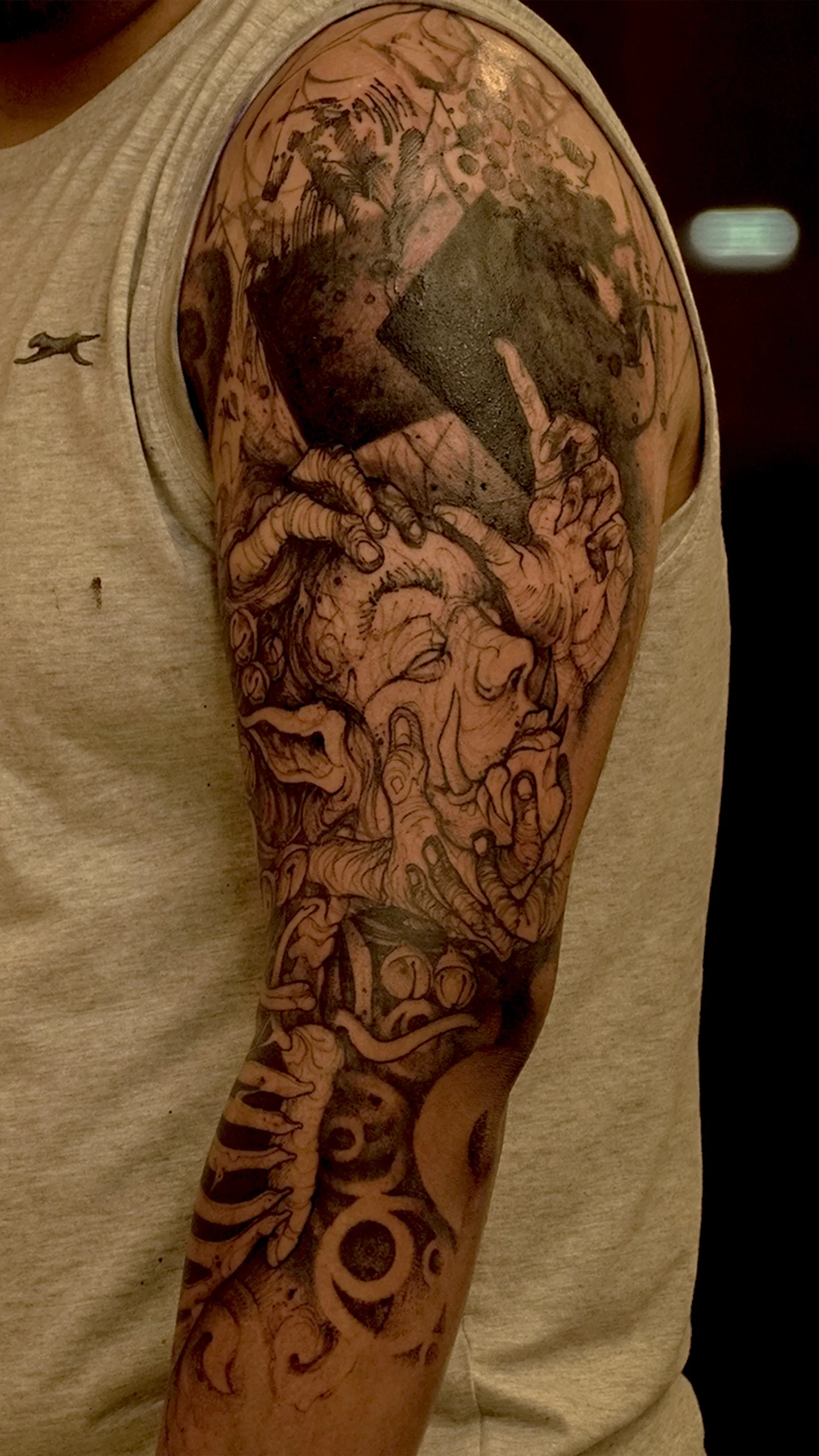 Dark art tattoo with symbolic composition and textured black and grey depth by Otzi Marc