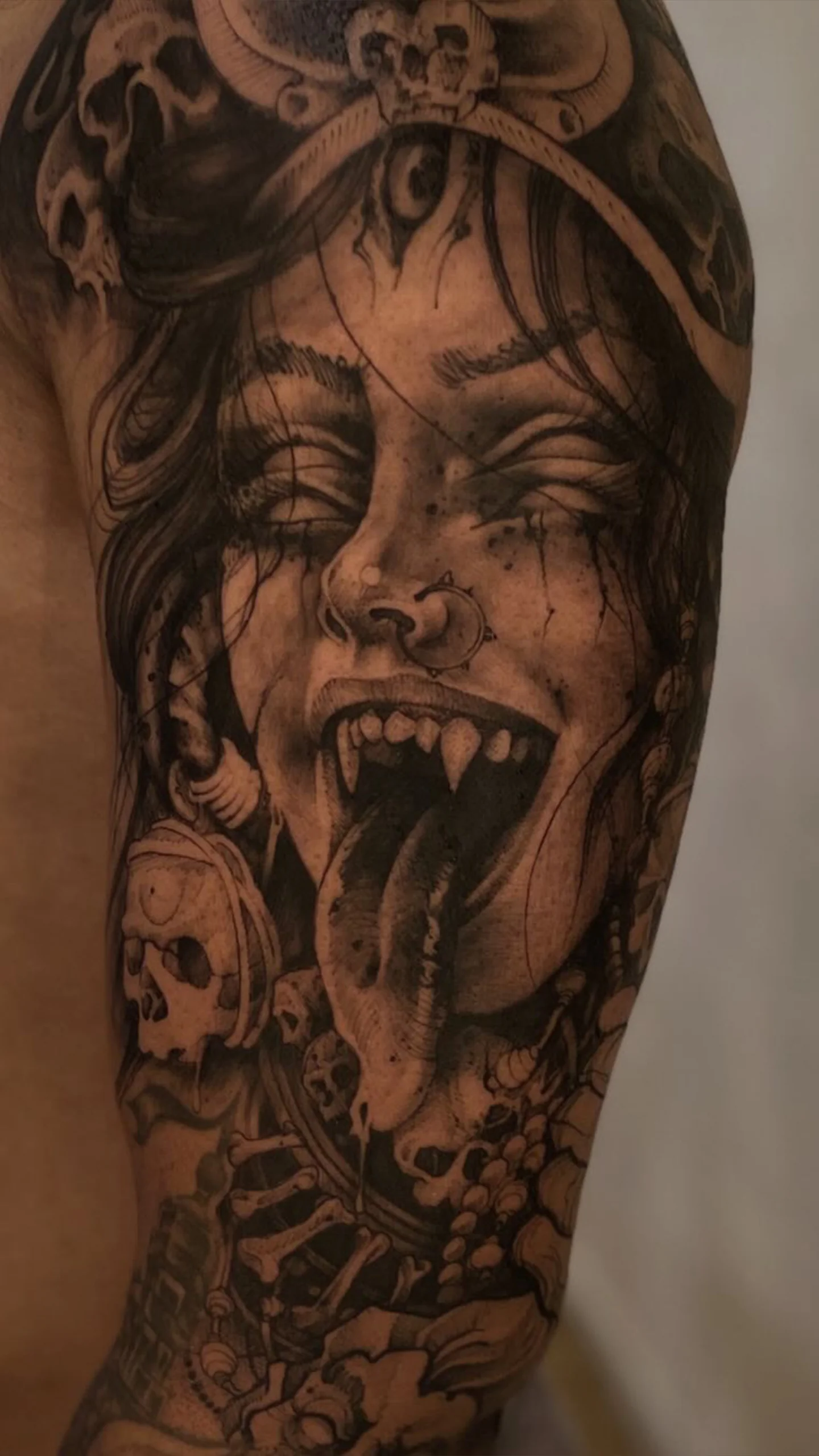 Black and grey tattoo featuring soft shading transitions and refined illustrative structure by Otzi Marc