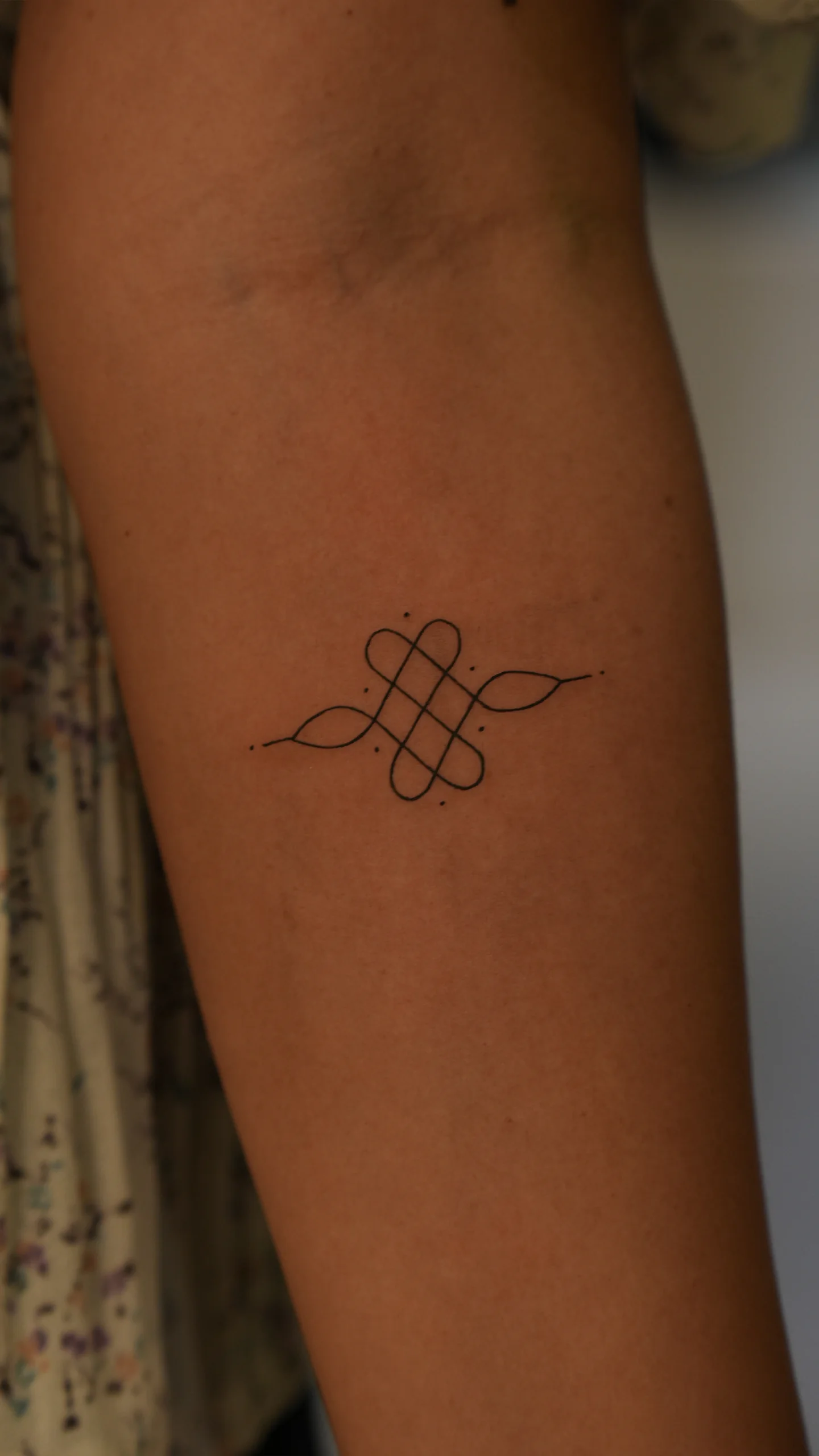 Black and grey illustrative tattoo with bold shading and refined textural detail by Roshan