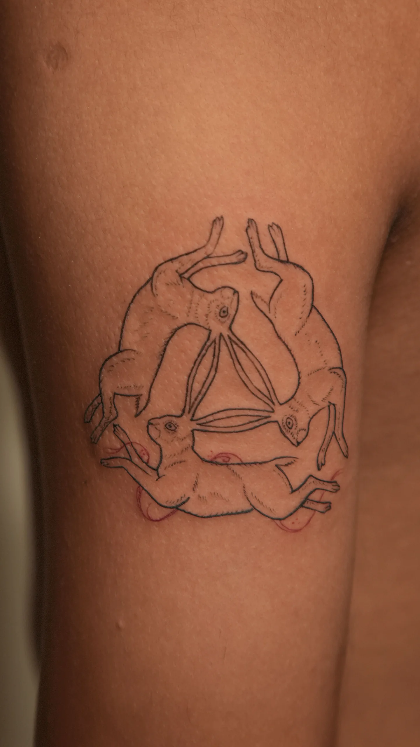 Illustrative tattoo featuring clean bold lines and controlled contrast by Roshan