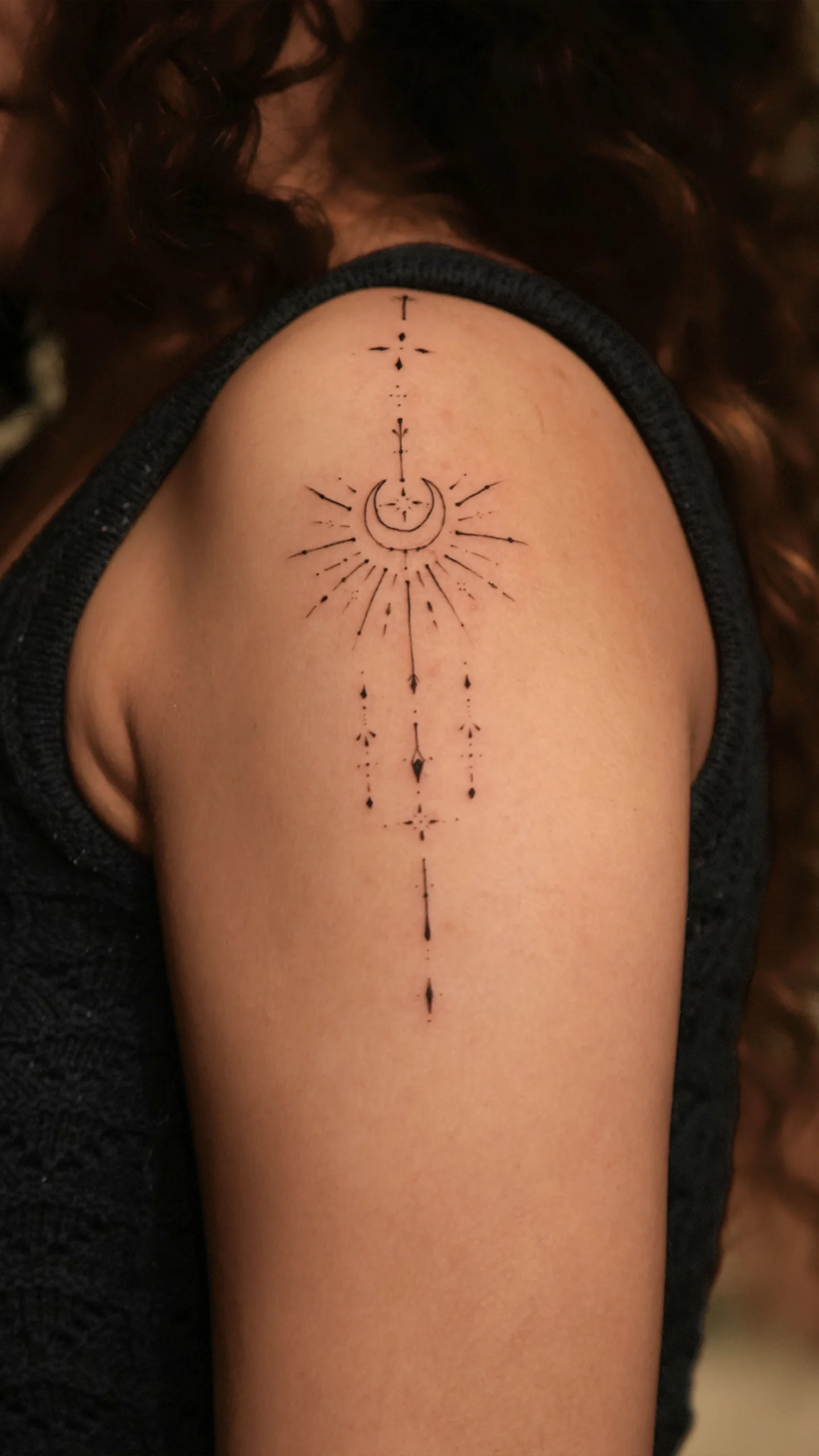 Semi-realistic black and grey tattoo featuring soft gradients and textural tone by Roshan